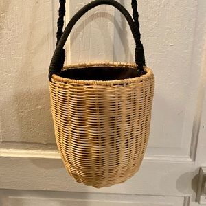 Basket purse with a synch shut and black strap